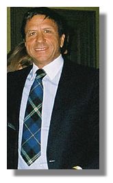 sir Rocco Forte wearing  an Italian National Tartan tie presented to him by Clan Italia