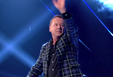 Simple Minds frontman Jim Kerr wearing Italian National tartan jacket