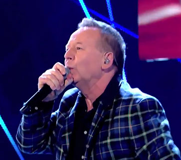 Simple Minds frontman Jim Kerr wearing Italian National tartan jacket